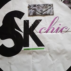 Black multi color clutch. Great accessary piece